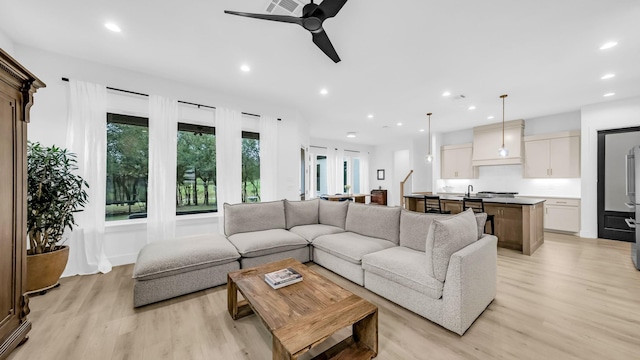 141 Lakeside Dr, Lipan, TX 76462 - living room featuring light wood-style floors, a ceiling fan, and recessed lighting
