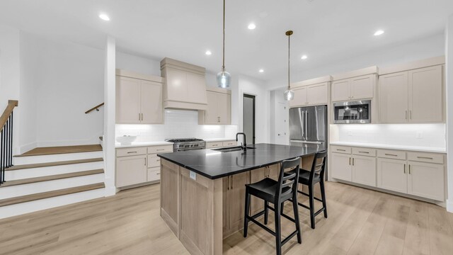 141 Lakeside Dr, Lipan, TX 76462 - kitchen with appliances with stainless steel finishes, premium range hood, a sink, decorative backsplash, and a kitchen breakfast bar