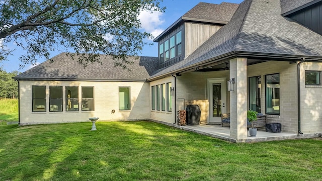 141 Lakeside Dr, Lipan, TX 76462 - back of house with a shingled roof and a yard