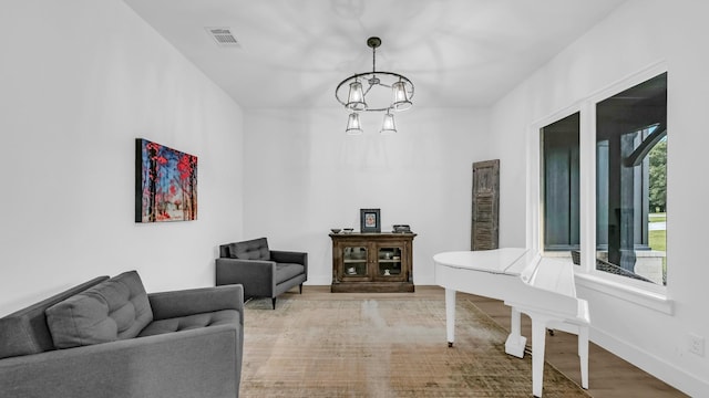 141 Lakeside Dr, Lipan, TX 76462 - interior space featuring a chandelier, wood finished floors, and baseboards