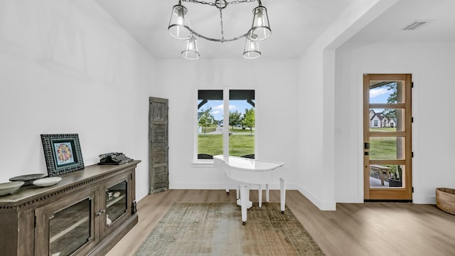 141 Lakeside Dr, Lipan, TX 76462 - foyer with wood finished floors, a chandelier, and baseboards