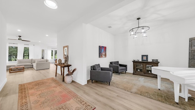 141 Lakeside Dr, Lipan, TX 76462 - living room featuring wood finished floors, recessed lighting, ceiling fan, a chandelier, and baseboards
