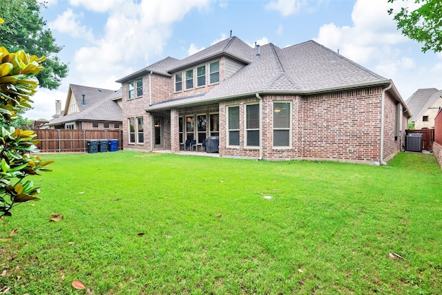 1200 Thornberry Dr, Mckinney, TX 75071 - rear view of house featuring central AC, brick siding, and a shingled roof