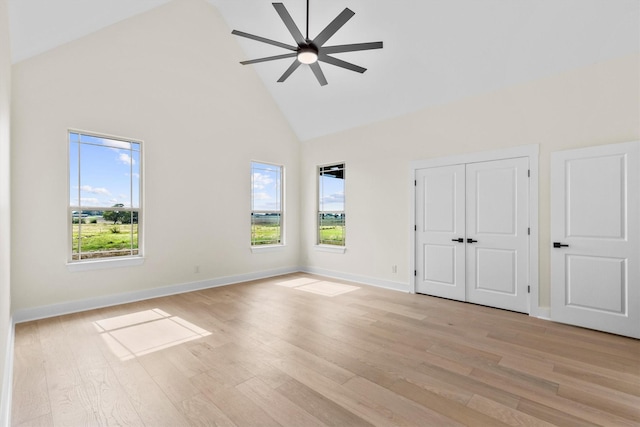 1128 Dixie Estates Way, Whitesboro, TX 76273 - unfurnished bedroom with high vaulted ceiling, light wood-type flooring, ceiling fan, baseboards, and a closet