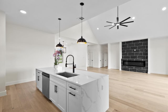 1128 Dixie Estates Way, Whitesboro, TX 76273 - kitchen with a sink, open floor plan, stainless steel dishwasher, hanging light fixtures, and recessed lighting