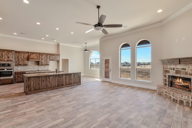 1022 Foolish Pleasure Dr, Terrell, TX 75160 - kitchen with stainless steel appliances, open floor plan, ceiling fan, decorative backsplash, and recessed lighting