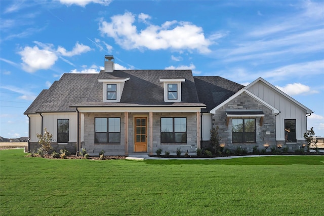4665 Christie Ave, Caddo Mills, TX 75135 - view of front of home featuring a front yard, board and batten siding, a chimney, and stone siding