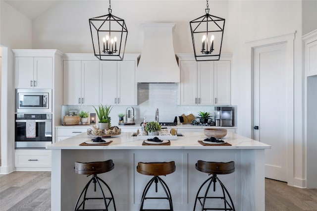 4665 Christie Ave, Caddo Mills, TX 75135 - kitchen with stainless steel appliances, a chandelier, wall chimney exhaust hood, tasteful backsplash, and high vaulted ceiling