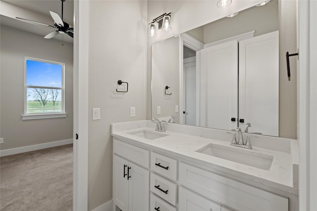 4665 Christie Ave, Caddo Mills, TX 75135 - bathroom with double vanity, ceiling fan, and baseboards