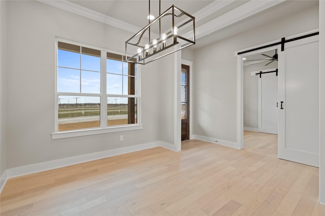 4665 Christie Ave, Caddo Mills, TX 75135 - unfurnished dining area featuring a barn door, a chandelier, crown molding, wood finished floors, and baseboards