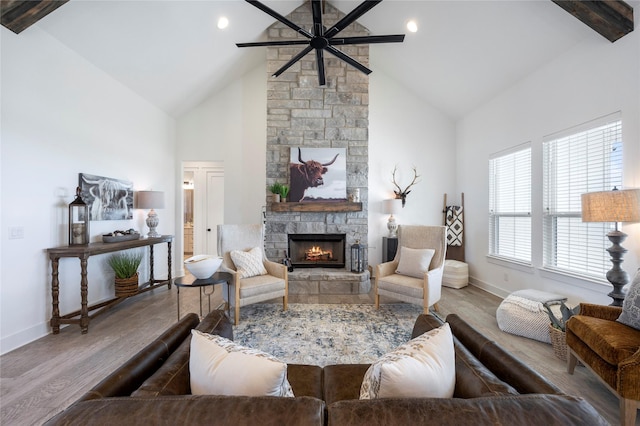 4665 Christie Ave, Caddo Mills, TX 75135 - living room with high vaulted ceiling, a fireplace, a ceiling fan, wood finished floors, and baseboards