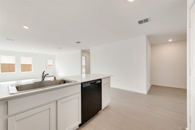 4900 Arden Springs Ave, Fort Worth, TX 76179 - kitchen featuring dishwasher, a sink, light wood finished floors, recessed lighting, and white cabinets