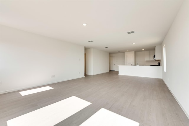 4900 Arden Springs Ave, Fort Worth, TX 76179 - unfurnished living room featuring recessed lighting, light wood-type flooring, and baseboards