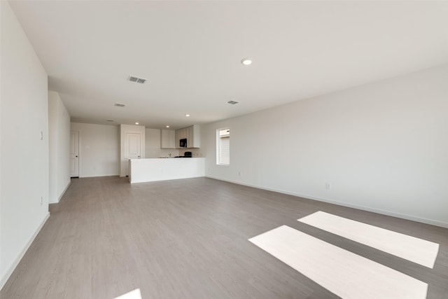 4900 Arden Springs Ave, Fort Worth, TX 76179 - unfurnished living room with baseboards, light wood-type flooring, and recessed lighting