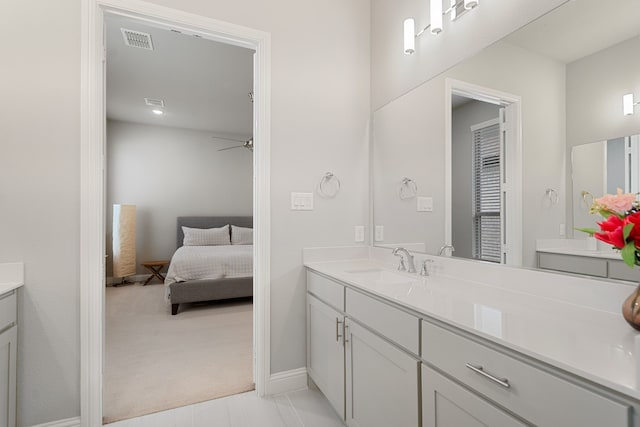 11415 Four Roses Trl, Frisco, TX 75035 - full bathroom featuring vanity, a ceiling fan, baseboards, and connected bathroom