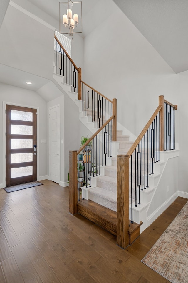 11415 Four Roses Trl, Frisco, TX 75035 - foyer entrance featuring stairway, wood finished floors, a chandelier, baseboards, and a high ceiling