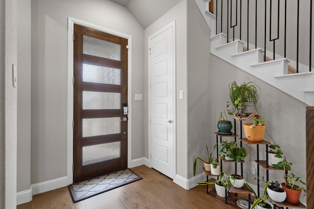 11415 Four Roses Trl, Frisco, TX 75035 - entryway featuring stairs, wood finished floors, and baseboards