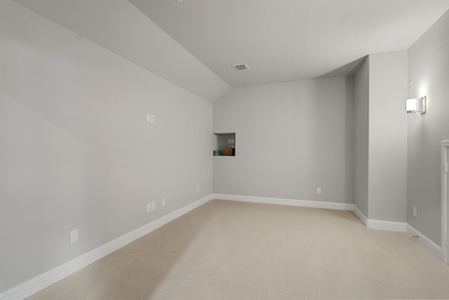 11415 Four Roses Trl, Frisco, TX 75035 - spare room featuring light carpet, baseboards, and lofted ceiling