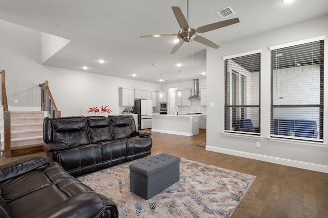 11415 Four Roses Trl, Frisco, TX 75035 - living area with ceiling fan, stairway, wood finished floors, recessed lighting, and baseboards