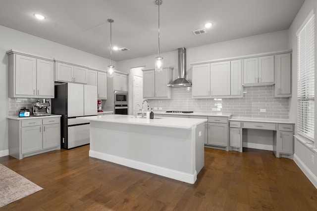 11415 Four Roses Trl, Frisco, TX 75035 - kitchen with wall chimney exhaust hood, stainless steel appliances, decorative backsplash, a sink, and light countertops