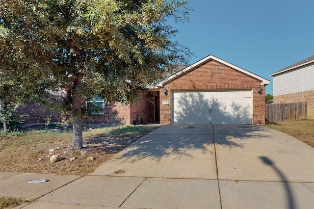 6133 Chalk Hollow Dr, Fort Worth, TX 76179 - view of front of property with brick siding, driveway, and a garage