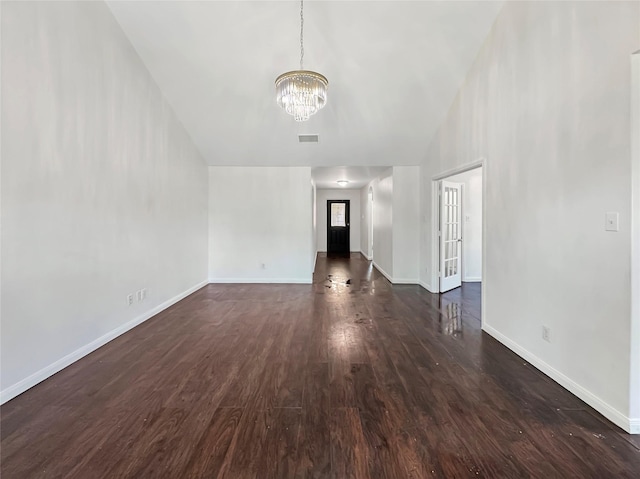 6133 Chalk Hollow Dr, Fort Worth, TX 76179 - unfurnished living room featuring a chandelier, dark wood-type flooring, and baseboards