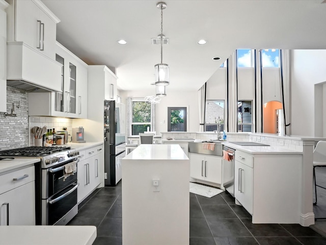 2505 Trailhead Dr, Fort Worth, TX 76177 - kitchen featuring stainless steel appliances, an island with sink, a sink, backsplash, and recessed lighting
