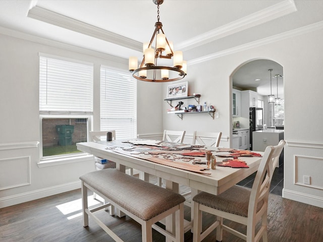 2505 Trailhead Dr, Fort Worth, TX 76177 - dining area with a chandelier, a raised ceiling, crown molding, and wood finished floors
