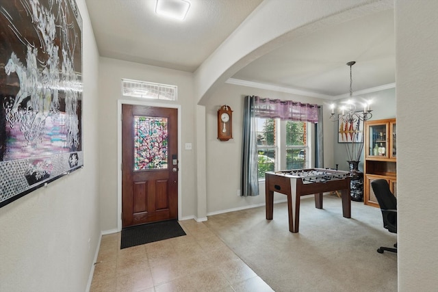 1717 Quail Grove Dr, Fort Worth, TX 76177 - foyer featuring arched walkways, a chandelier, baseboards, and crown molding