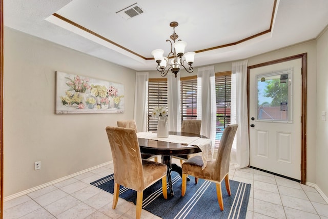 2605 Pickwick Ln, Plano, TX 75093 - dining room featuring a tray ceiling, light tile patterned floors, a chandelier, and baseboards