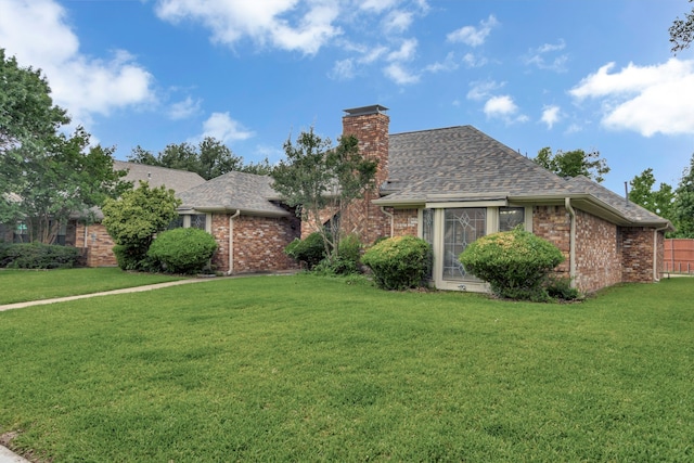 2605 Pickwick Ln, Plano, TX 75093 - view of front facade featuring brick siding, a chimney, and a shingled roof