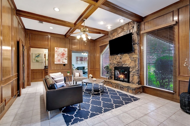 2605 Pickwick Ln, Plano, TX 75093 - living room with a decorative wall, a stone fireplace, beamed ceiling, light tile patterned flooring, and ceiling fan