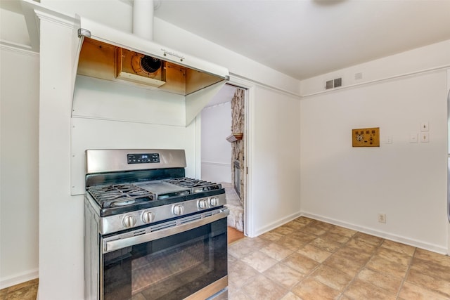 2109 Blake Ave, Dallas, TX 75228 - kitchen featuring gas stove and baseboards