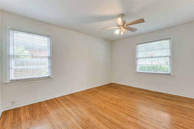 2109 Blake Ave, Dallas, TX 75228 - unfurnished room with healthy amount of natural light, light wood-style flooring, baseboards, and a ceiling fan