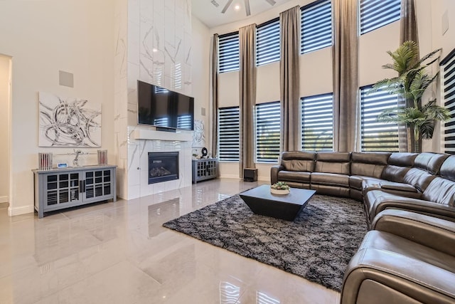 3509 Meridian Dr, Northlake, TX 76226 - living room featuring a high ceiling, a fireplace, and tile patterned flooring
