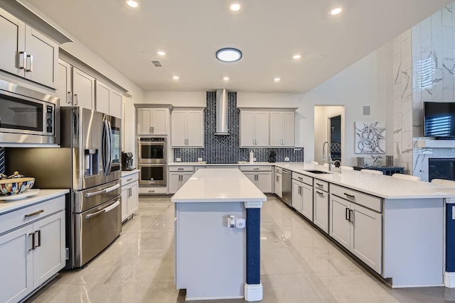 3509 Meridian Dr, Northlake, TX 76226 - kitchen featuring stainless steel appliances, wall chimney range hood, a peninsula, a center island, and tasteful backsplash