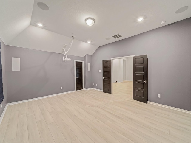 3509 Meridian Dr, Northlake, TX 76226 - unfurnished living room featuring vaulted ceiling, light wood-type flooring, and recessed lighting