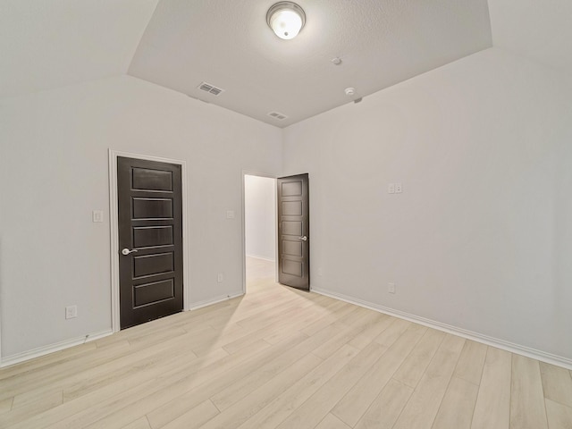3509 Meridian Dr, Northlake, TX 76226 - empty room featuring light wood-style floors and vaulted ceiling