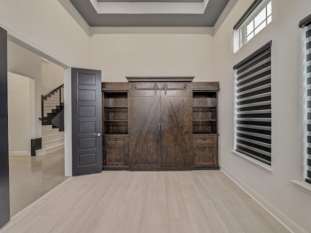 3509 Meridian Dr, Northlake, TX 76226 - foyer featuring light wood-style floors, stairway, and a tray ceiling