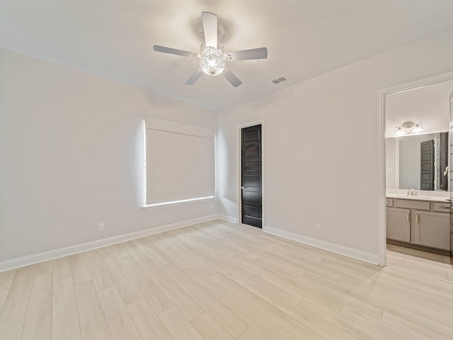 3509 Meridian Dr, Northlake, TX 76226 - unfurnished bedroom featuring light wood-style floors, a ceiling fan, and connected bathroom