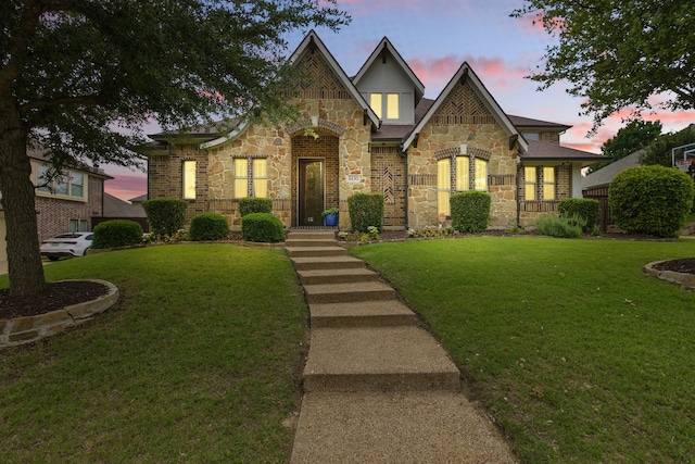 1430 Crescent Valley Dr, Prosper, TX 75078 - tudor home with stone siding and a lawn