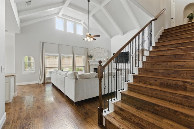 1430 Crescent Valley Dr, Prosper, TX 75078 - living area featuring high vaulted ceiling, ceiling fan, stairs, a fireplace, and dark wood finished floors