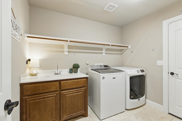 1430 Crescent Valley Dr, Prosper, TX 75078 - laundry room with washing machine and clothes dryer, light tile patterned floors, cabinet space, and baseboards