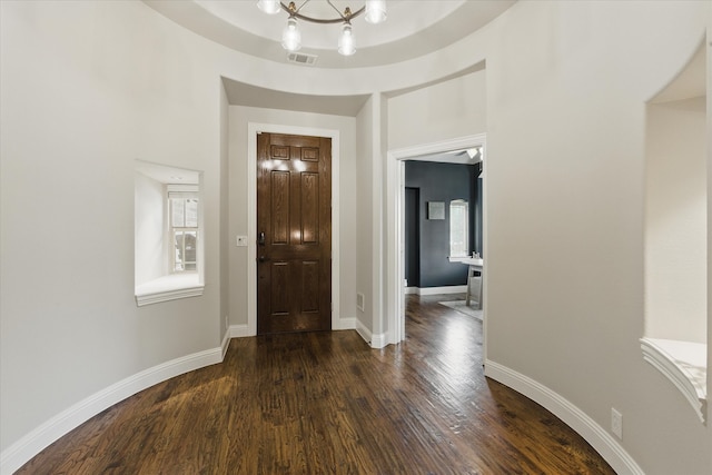 1430 Crescent Valley Dr, Prosper, TX 75078 - entrance foyer featuring dark wood finished floors, a chandelier, and baseboards