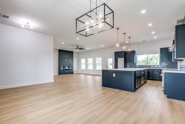 1450 W Fm 550, Mclendon Chisholm, TX 75032 - kitchen with recessed lighting, tasteful backsplash, a chandelier, light countertops, and plenty of natural light