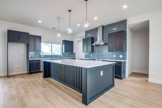 1450 W Fm 550, Mclendon Chisholm, TX 75032 - kitchen with wall chimney exhaust hood, a sink, a kitchen island, light wood-style floors, and decorative backsplash