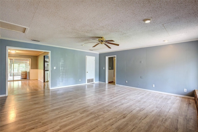 201 Brookhaven Ter, Commerce, TX 75428 - empty room with crown molding, wood finished floors, a ceiling fan, baseboards, and a textured ceiling