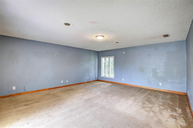 201 Brookhaven Ter, Commerce, TX 75428 - carpeted empty room with baseboards and a textured ceiling