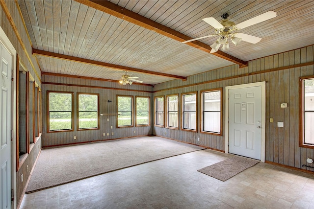 201 Brookhaven Ter, Commerce, TX 75428 - unfurnished sunroom featuring a ceiling fan, tile patterned floors, wood walls, and beamed ceiling