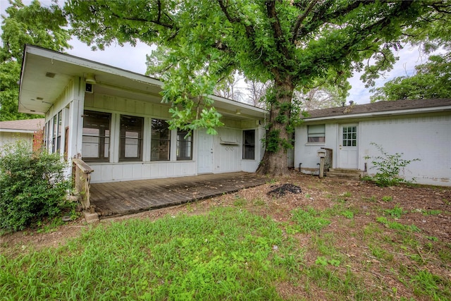 201 Brookhaven Ter, Commerce, TX 75428 - back of property featuring board and batten siding
